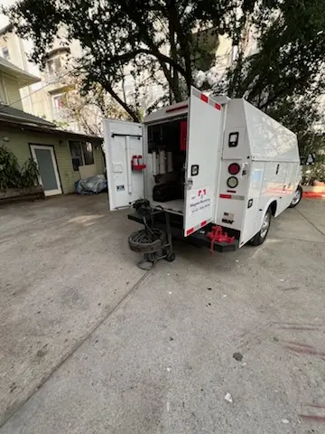 Magnet Plumbing service vehicle on-site for Grease Trap Cleaning in North San Antonio Hills